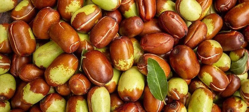 Close-up of seeds with a leaf