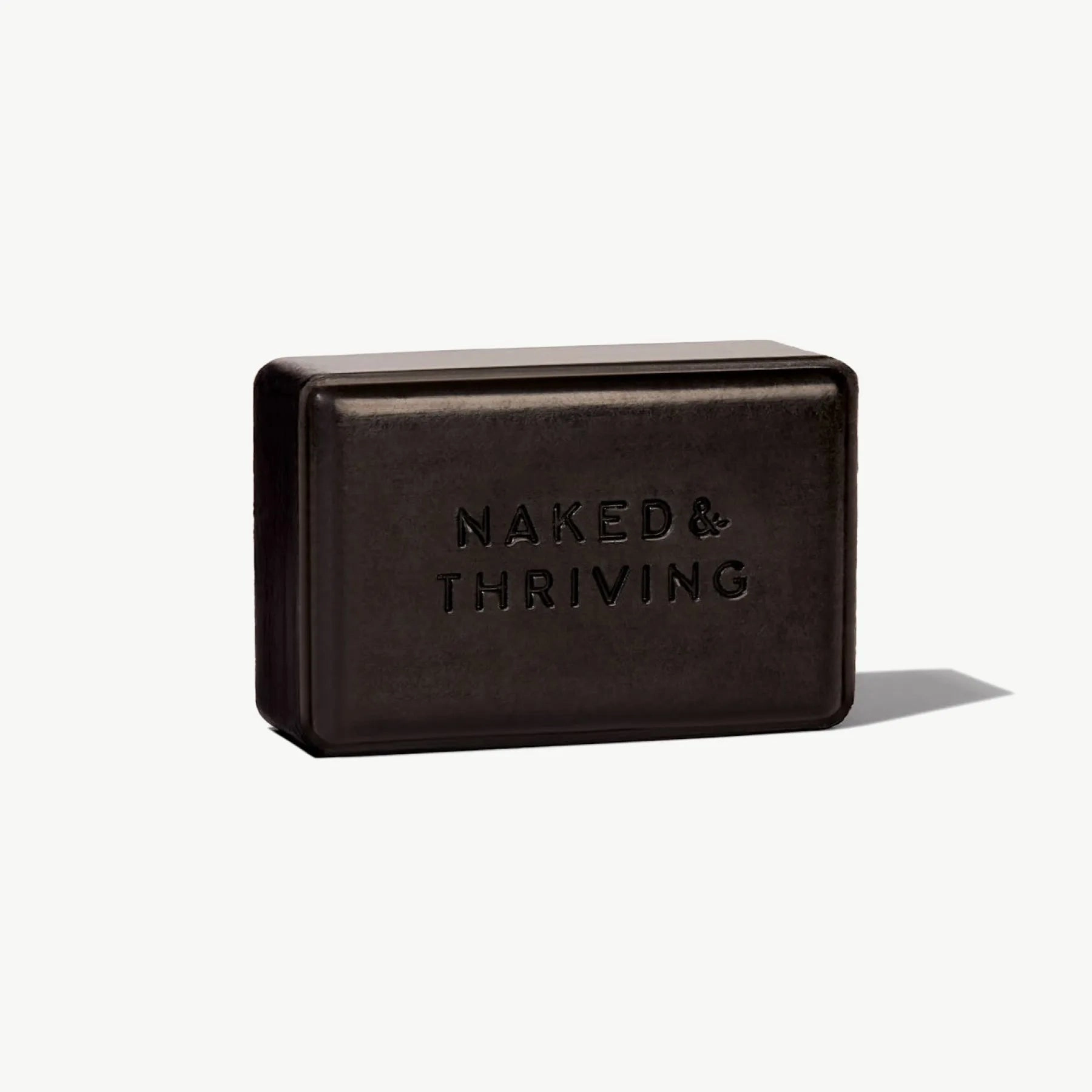 Black Purify Charcoal Cleansing Bar by Naked & Thriving displayed on white background